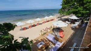 View of the beach and deck below
